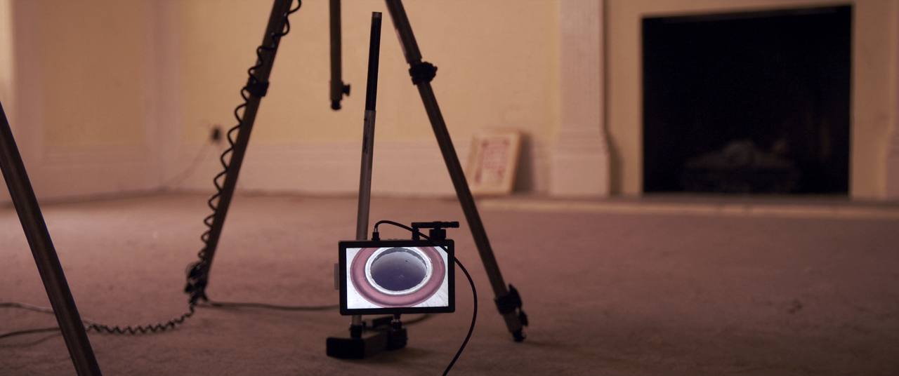 Chimney inspection camera and monitor showing the interior of a clay tile flue